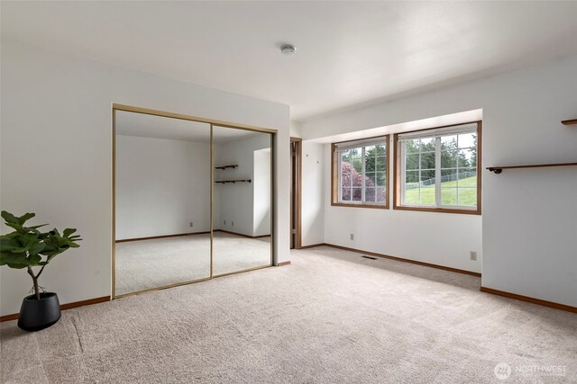 1442 SW Ponsteen Dr, Oak Harbor, WA 98277 - unfurnished bedroom featuring carpet, a closet, and baseboards
