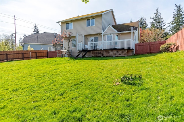 1442 SW Ponsteen Dr, Oak Harbor, WA 98277 - rear view of house with a wooden deck