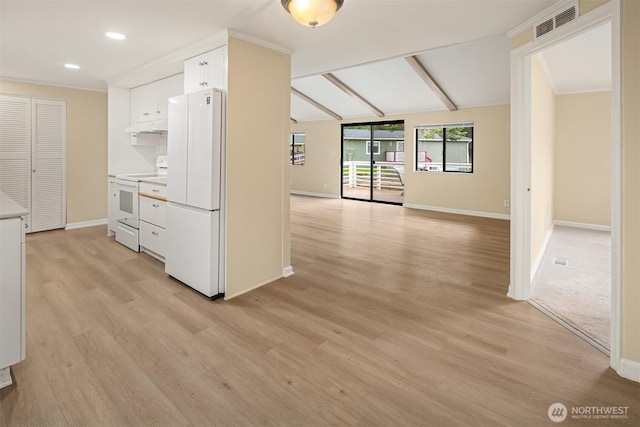 kitchen featuring under cabinet range hood, light countertops, light wood-style floors, white appliances, and white cabinetry