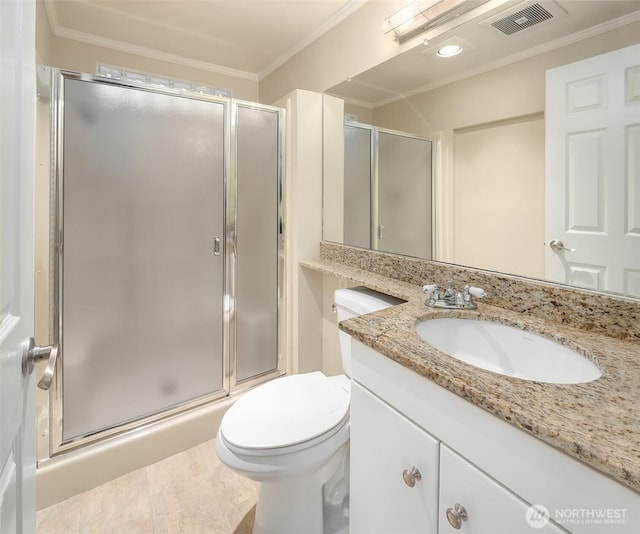 bathroom featuring visible vents, a shower stall, vanity, and ornamental molding