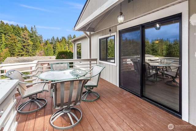 deck with outdoor dining area