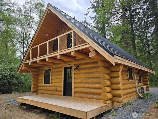 315 Skate Creek Rd N, Ashford, WA 98304 - rear view of property featuring log siding, a cooling unit, and metal roof