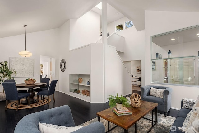 12423 NE 70th St, Kirkland, WA 98033 - living room with high vaulted ceiling, wood finished floors, and baseboards