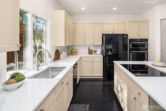 12423 NE 70th St, Kirkland, WA 98033 - kitchen with black appliances, a sink, dark wood-style flooring, backsplash, and recessed lighting