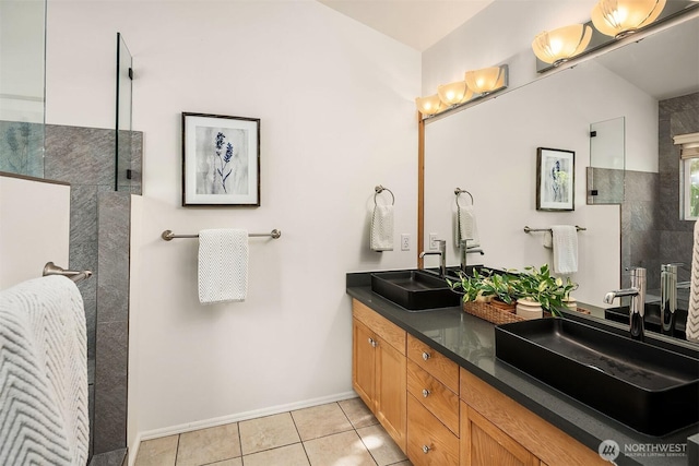 12423 NE 70th St, Kirkland, WA 98033 - bathroom with walk in shower, tile patterned floors, double vanity, and baseboards