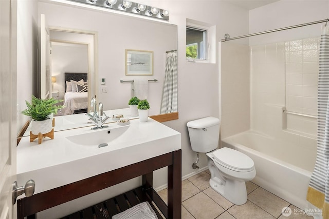 12423 NE 70th St, Kirkland, WA 98033 - ensuite bathroom featuring toilet, tile patterned flooring, vanity, baseboards, and shower / bath combo with shower curtain