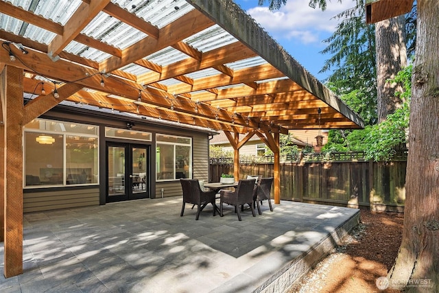 12423 NE 70th St, Kirkland, WA 98033 - view of patio featuring french doors, fence, a pergola, and outdoor dining area