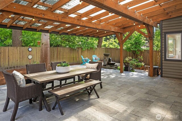 12423 NE 70th St, Kirkland, WA 98033 - view of patio / terrace with outdoor dining area, a pergola, and a fenced backyard