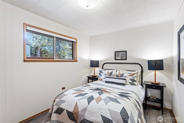 bedroom with wood finished floors