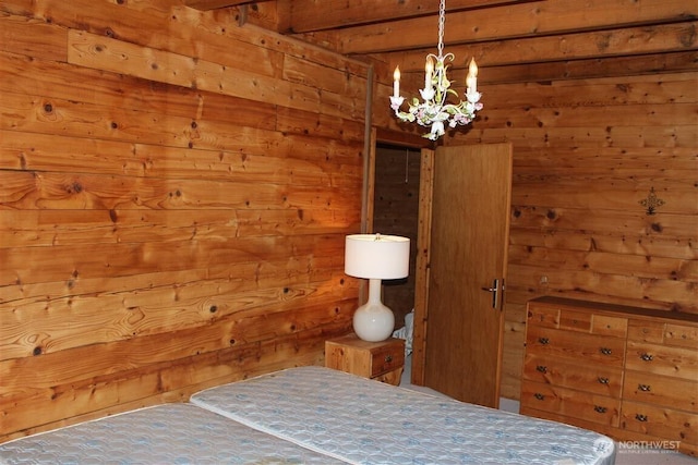 23 Brown Is, Brown Island, WA 98250 - bedroom featuring wooden walls and a chandelier