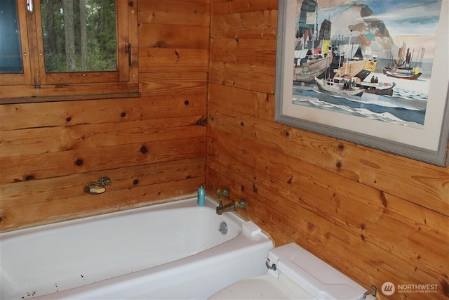 23 Brown Is, Brown Island, WA 98250 - full bathroom with wooden walls, a tub to relax in, and toilet