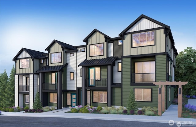 14346 1st Ave NE Unit 54-E, Duvall, WA 98019 - view of front of house with metal roof, board and batten siding, and a standing seam roof