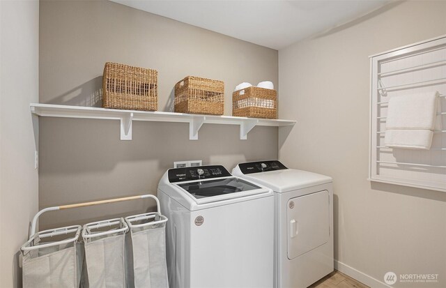 14346 1st Ave NE Unit 54-E, Duvall, WA 98019 - laundry room featuring washer and dryer, laundry area, light wood-style floors, and baseboards