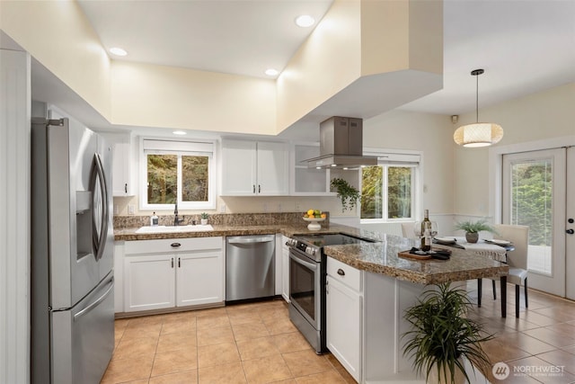 22789 S Kingston Rd NE, Kingston, WA 98346 - kitchen featuring a peninsula, island exhaust hood, a sink, stainless steel appliances, and white cabinets