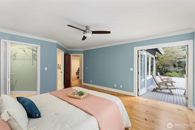 22789 S Kingston Rd NE, Kingston, WA 98346 - bedroom featuring access to exterior, crown molding, and wood finished floors