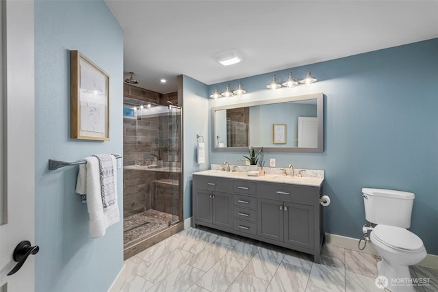 22789 S Kingston Rd NE, Kingston, WA 98346 - bathroom with a stall shower, toilet, marble finish floor, and a sink