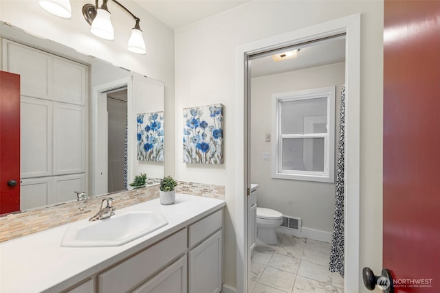 22789 S Kingston Rd NE, Kingston, WA 98346 - bathroom with visible vents, toilet, marble finish floor, baseboards, and vanity