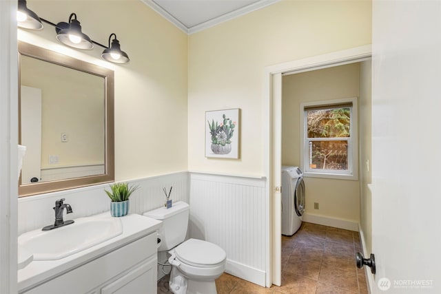22789 S Kingston Rd NE, Kingston, WA 98346 - bathroom featuring toilet, ornamental molding, wainscoting, tile patterned floors, and vanity