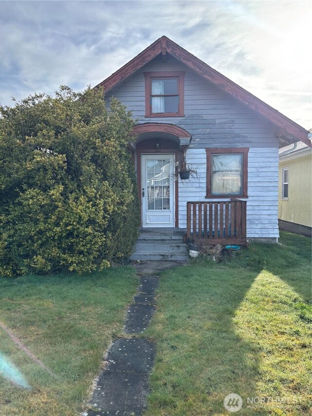 bungalow with a front yard