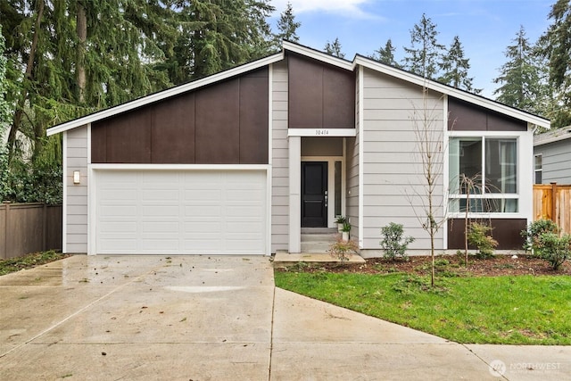 10414 113th Street Ct SW, Lakewood, WA 98498 - mid-century home featuring a garage, fence, and concrete driveway