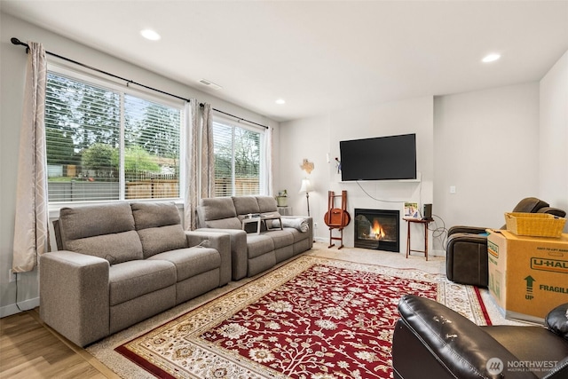 10414 113th Street Ct SW, Lakewood, WA 98498 - living area with visible vents, a glass covered fireplace, baseboards, and recessed lighting
