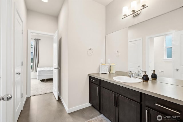 10414 113th Street Ct SW, Lakewood, WA 98498 - ensuite bathroom with baseboards, connected bathroom, and vanity