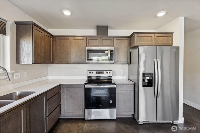 3108 Rock St, Malaga, WA 98828 - kitchen featuring stainless steel appliances, a sink, concrete flooring, light countertops, and recessed lighting