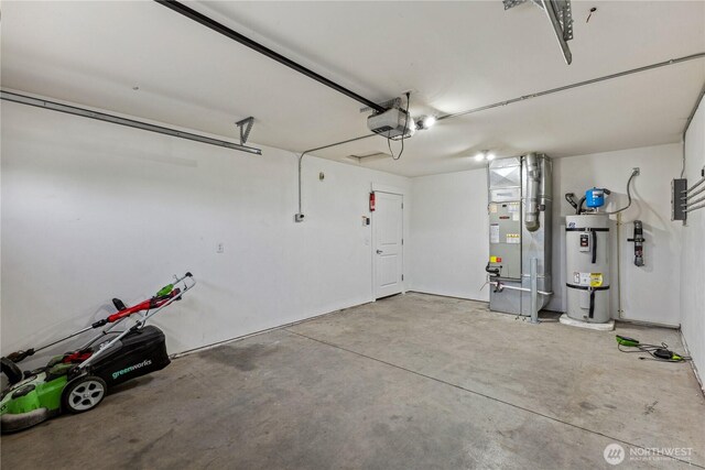 3108 Rock St, Malaga, WA 98828 - garage with water heater, a garage door opener, and heating unit