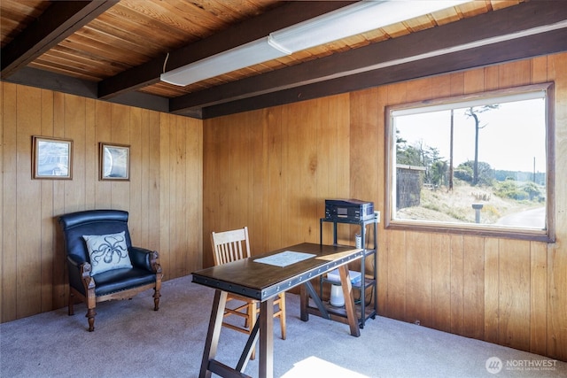 carpeted home office featuring wood ceiling, beamed ceiling, and wooden walls