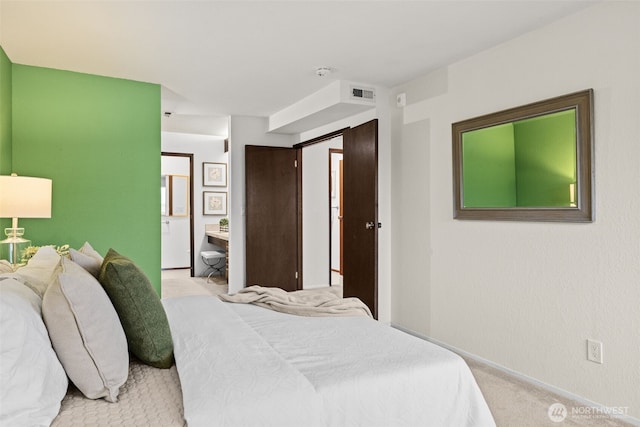 carpeted bedroom featuring visible vents and baseboards