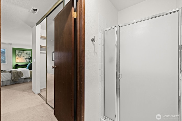 bathroom featuring visible vents, a stall shower, and ensuite bathroom
