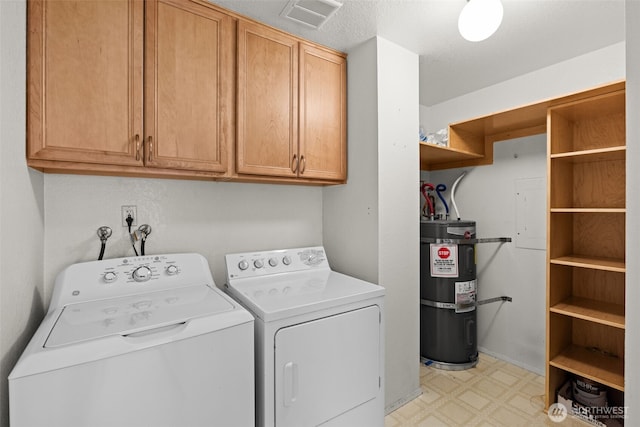 clothes washing area featuring strapped water heater, light floors, visible vents, cabinet space, and washing machine and dryer