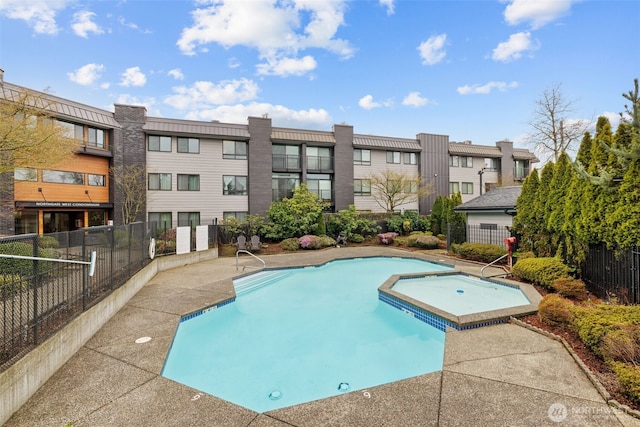 view of pool with fence