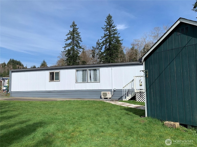 302 Pioneer Rd, Aberdeen, WA 98520 - rear view of property with a lawn