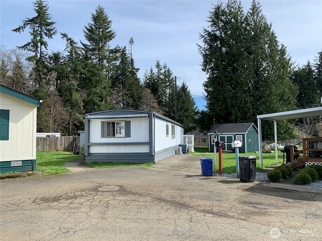 302 Pioneer Rd, Aberdeen, WA 98520 - view of front facade with a storage unit and asphalt driveway