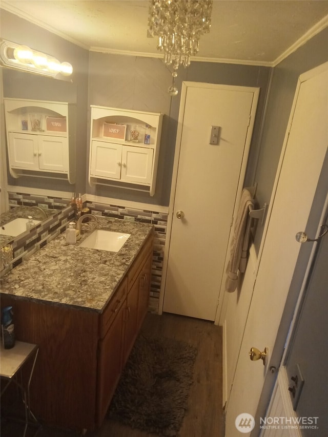 302 Pioneer Rd, Aberdeen, WA 98520 - bathroom with ornamental molding, vanity, and wood finished floors