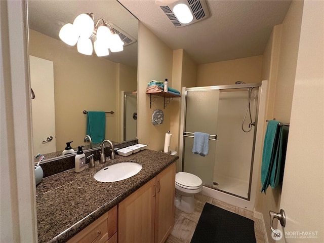 full bathroom featuring visible vents, a chandelier, a shower stall, toilet, and vanity