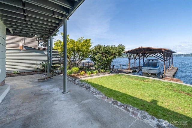 view of patio / terrace featuring stairs, a water view, boat lift, and a dock