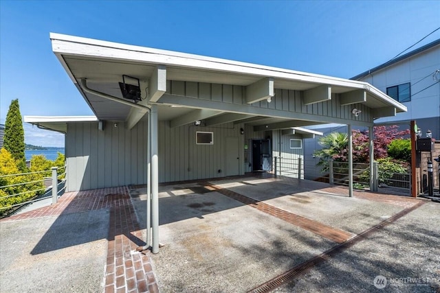 view of front of home featuring board and batten siding and fence