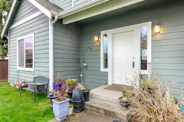 property entrance featuring a yard