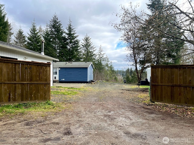 exterior space with dirt driveway