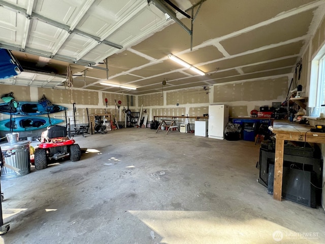 garage with a workshop area
