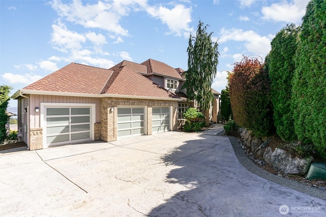 15832 SE 45th St, Bellevue, WA 98006 - view of side of property featuring an attached garage and concrete driveway