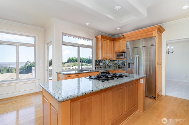 15832 SE 45th St, Bellevue, WA 98006 - kitchen featuring built in appliances, light stone counters, a center island, and light wood-style floors