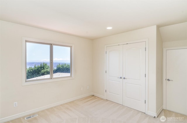 15832 SE 45th St, Bellevue, WA 98006 - unfurnished bedroom with baseboards, visible vents, recessed lighting, light colored carpet, and a closet