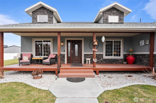 3609 Lakeshore Dr, Moses Lake, WA 98837 - view of exterior entry with stone siding, covered porch, and stucco siding
