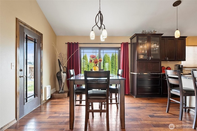 3609 Lakeshore Dr, Moses Lake, WA 98837 - dining room featuring dark wood finished floors, baseboards, and radiator heating unit