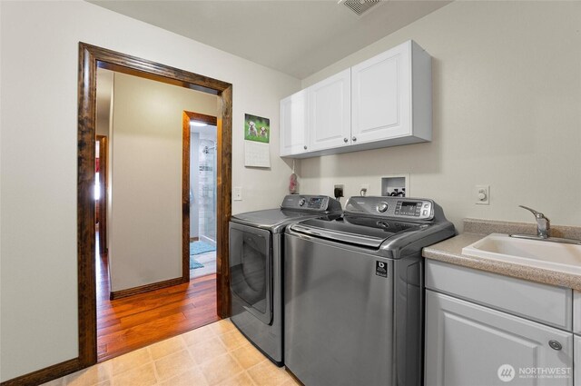 3609 Lakeshore Dr, Moses Lake, WA 98837 - laundry room featuring cabinet space, washer and dryer, and light floors