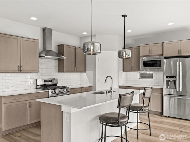11521 SE 236th St, Kent, WA 98031 - kitchen featuring stainless steel appliances, a sink, wall chimney range hood, light countertops, and tasteful backsplash
