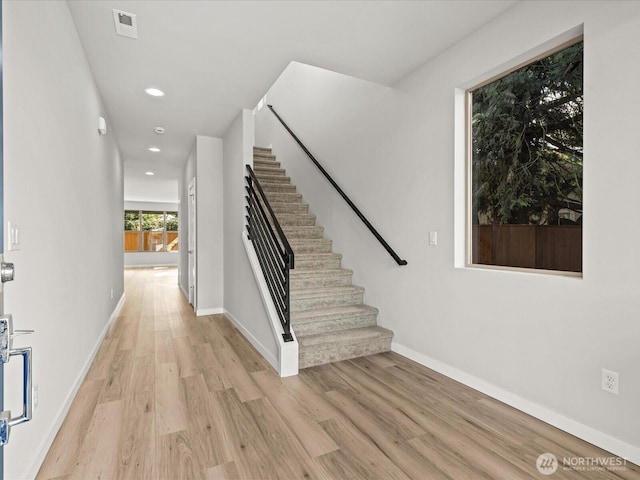 11521 SE 236th St, Kent, WA 98031 - stairs featuring wood finished floors, baseboards, and recessed lighting